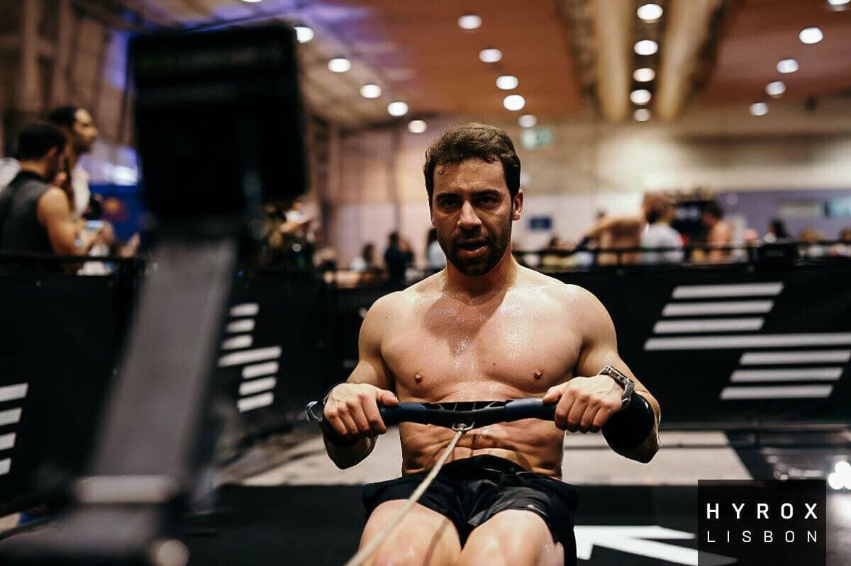 RoxZone athlete on row erg at HYROX Lisbon race
