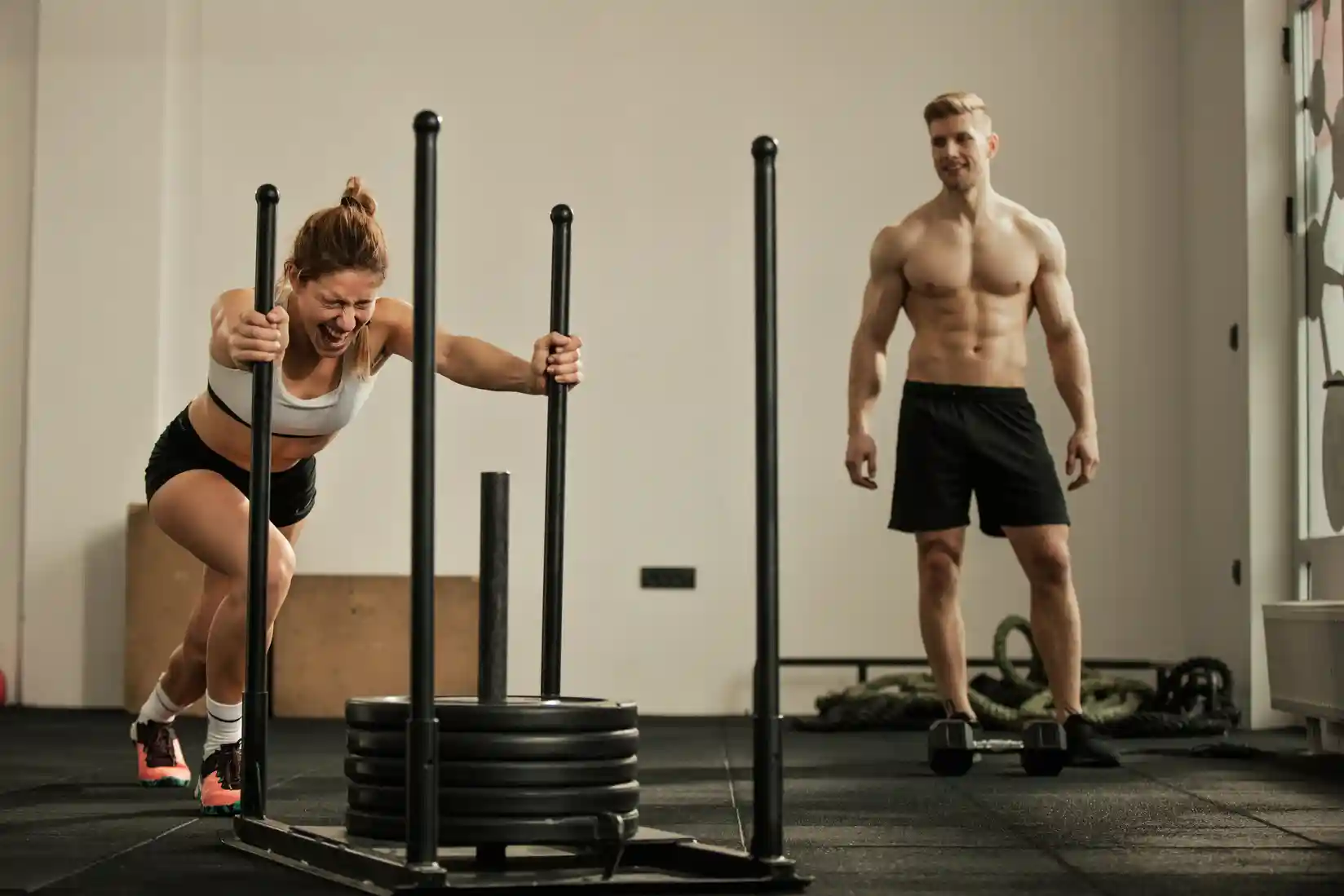 Two athletes training together for HYROX Doubles, performing functional exercises and runs to build teamwork, endurance, and race efficiency.