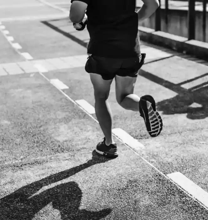 Male athlete running during the HYROX Hamburg Major 2025 hybrid fitness race