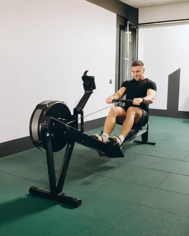 Athlete competing in a Hyrox-style race with running and functional training