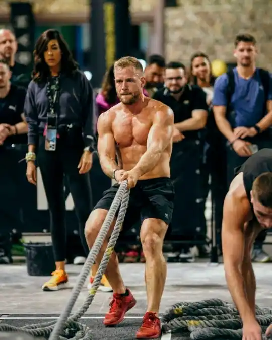 HYROX athlete performing sled pull during hybrid training programming